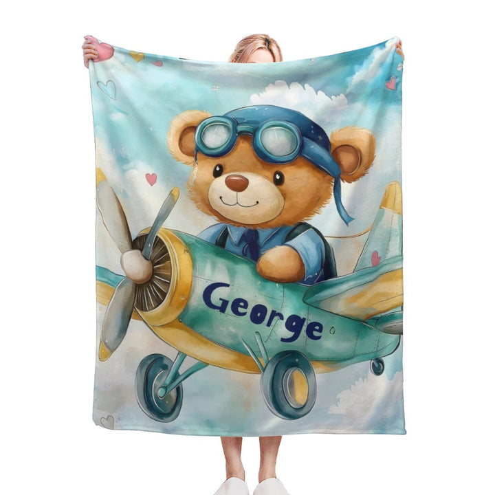 Sea Dragon Dreams personalised fleece blanket featuring a cute teddy bear pilot in a plane with custom name George