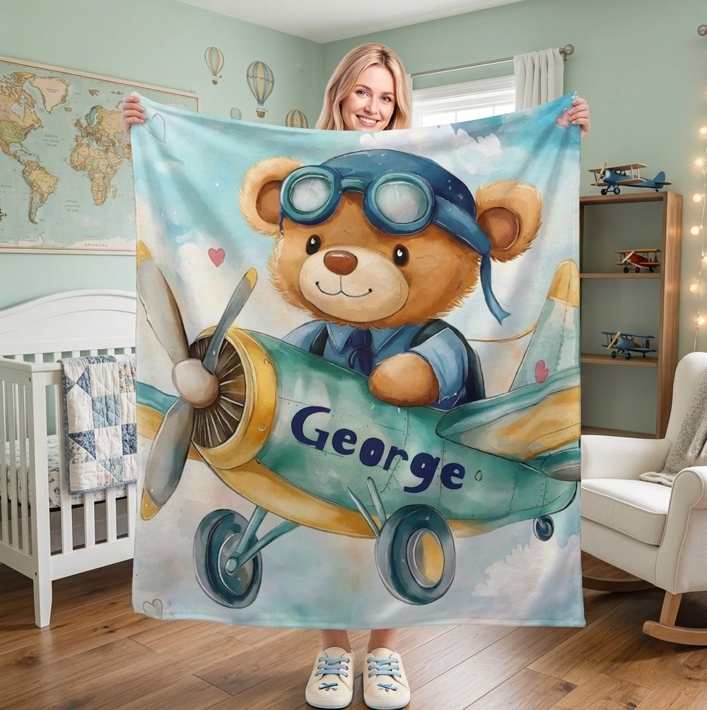 Sea Dragon Dreams personalised fleece blanket featuring a teddy bear pilot in a plane, customised with the name George.