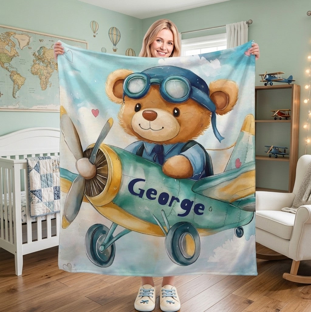 Sea Dragon Dreams personalised fleece blanket featuring a teddy bear pilot in a plane, customised with the name George.