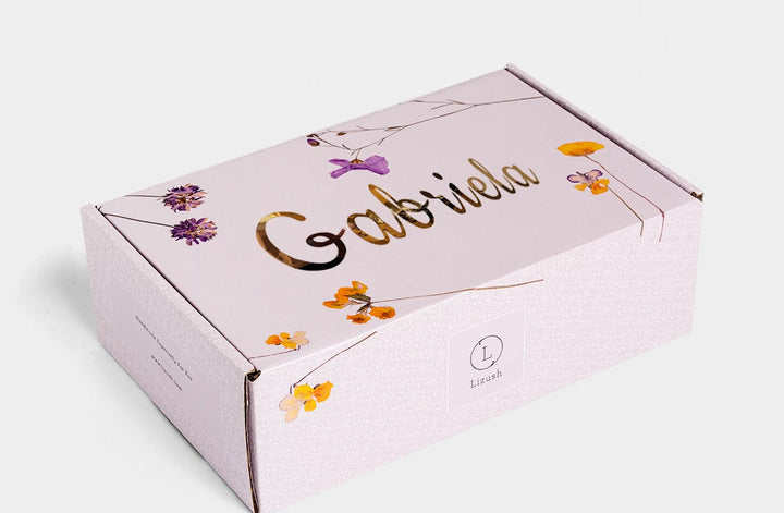 Sea Dragon Dreams personalized gift box with floral print and gold foil name on a light pink background