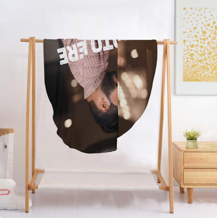 Sea Dragon Dreams personalized round flannel photo blanket draped on a wooden display rack in a bright room.