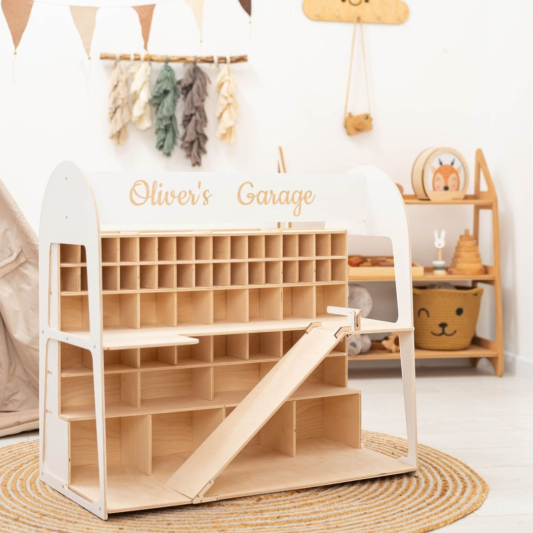 Sea Dragon Dreams personalized wooden toy car garage with multiple storage slots and a ramp in a bright nursery room.