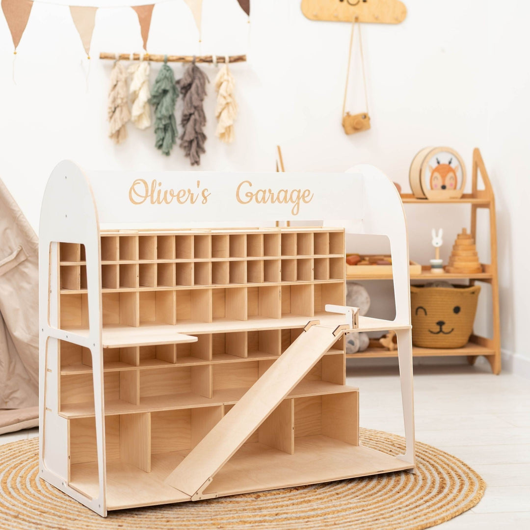 Sea Dragon Dreams personalized wooden toy car garage with multiple storage levels and a ramp in a nursery setting.