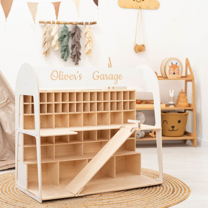 Sea Dragon Dreams personalized wooden toy car garage with multiple storage levels and a ramp in a nursery setting.