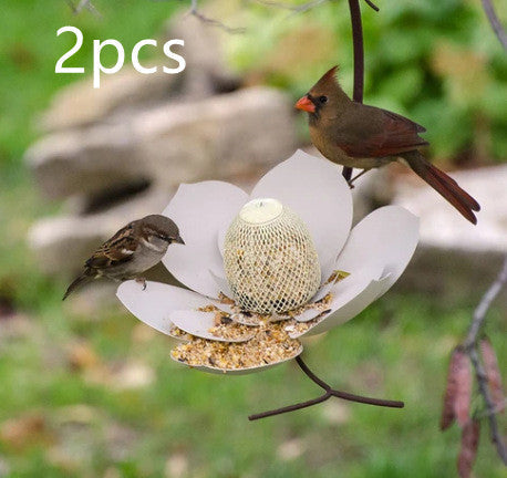 Sea Dragon Dreams petal-shaped bird feeder with mesh seed holder, attracting wild birds in a garden setting.