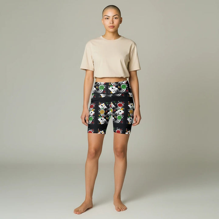 Model wearing Sea Dragon Dreams festive pickleball print workout shorts with a beige crop top on a neutral background.