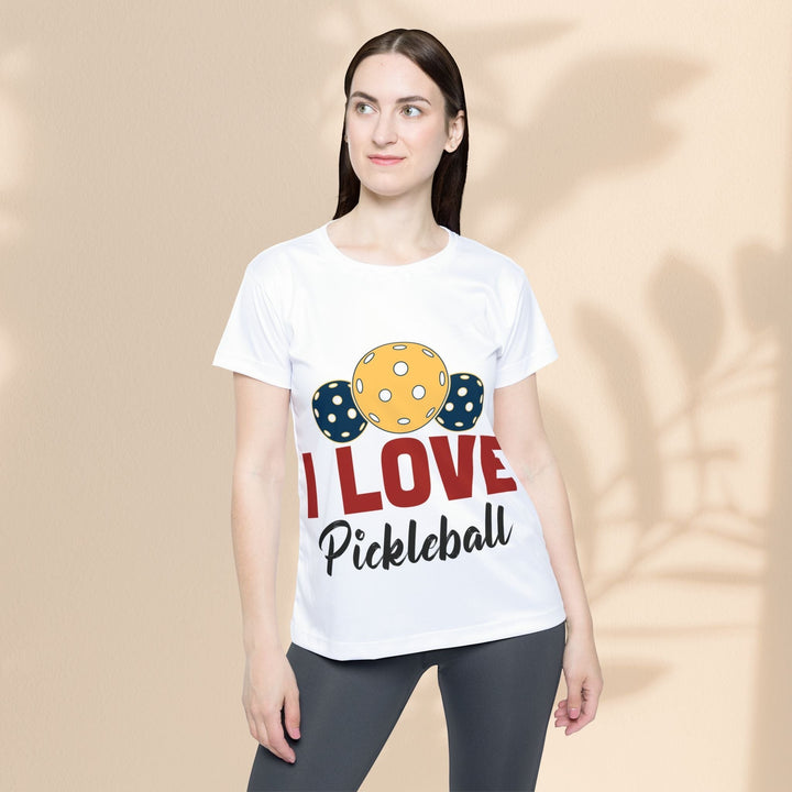Sea Dragon Dreams white moisture-wicking polyester pickleball jersey with I Love Pickleball graphic on a female model