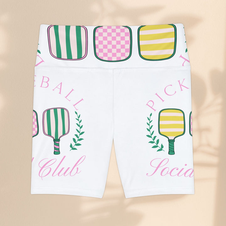 Sea Dragon Dreams women's white workout shorts with a colorful pickleball paddle print and elastic waistband.