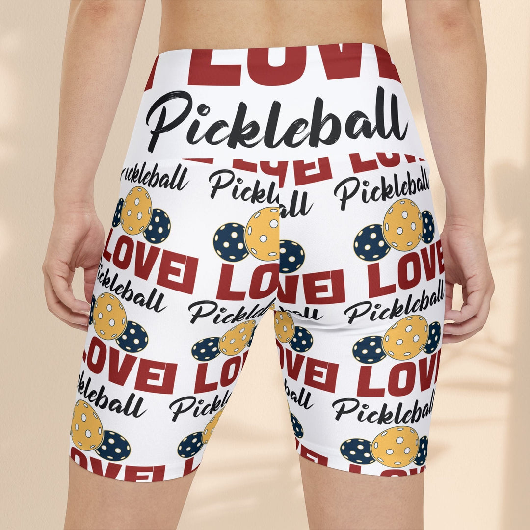 Sea Dragon Dreams women's workout shorts featuring a white base with red and yellow pickleball-themed print.