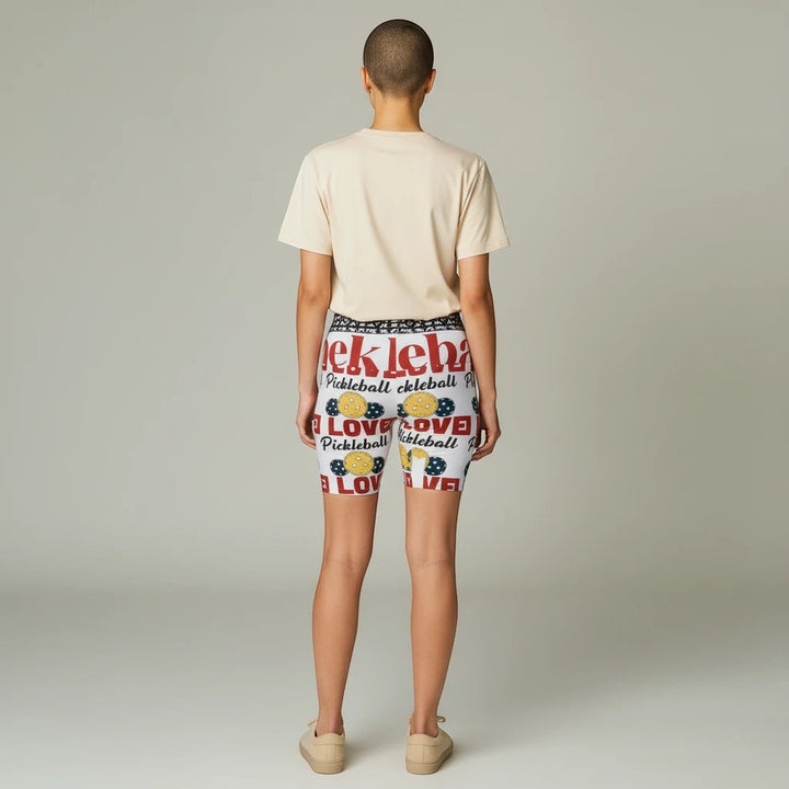 Sea Dragon Dreams women's workout shorts featuring a white pickleball print with red text and yellow balls