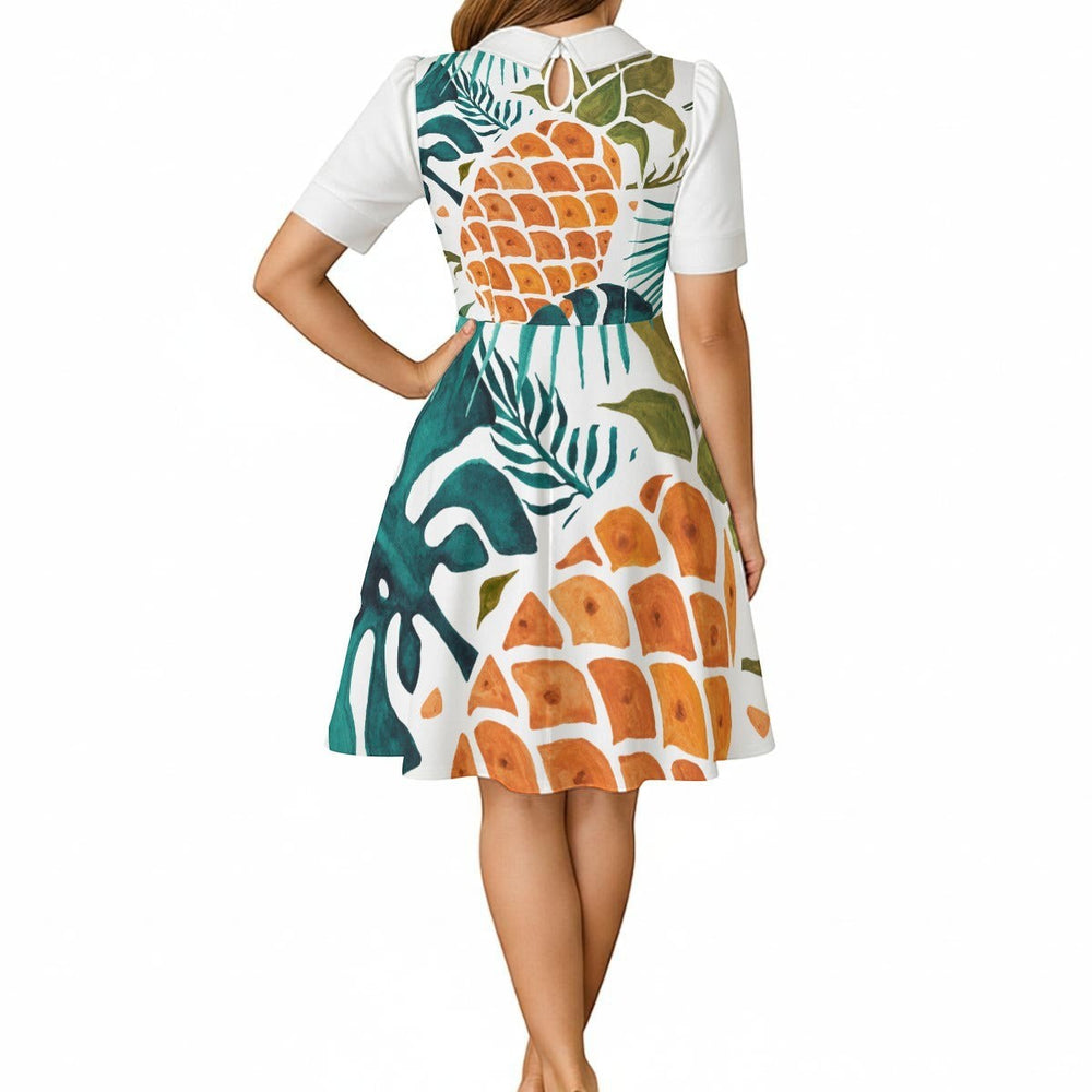 Sea Dragon Dreams A-line dress featuring a tropical pineapple and leaf print, white Peter Pan collar, and puff sleeves.