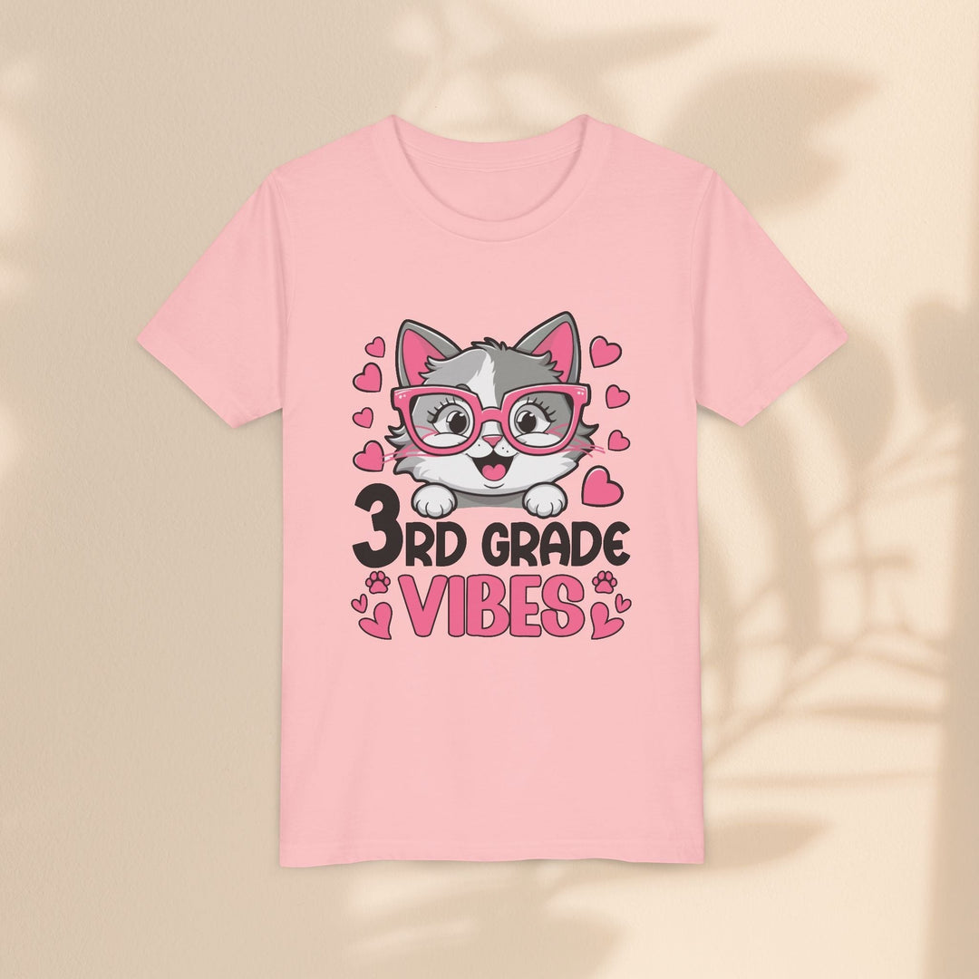 Sea Dragon Dreams light pink youth t-shirt featuring a cute cartoon cat wearing pink glasses and 3rd Grade Vibes text