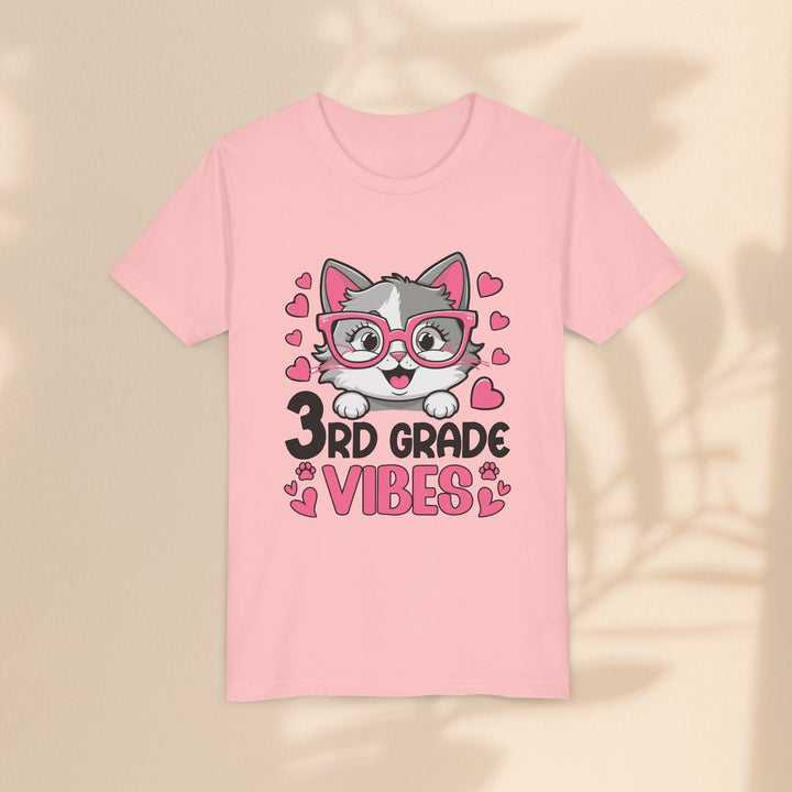 Sea Dragon Dreams light pink youth t-shirt featuring a cute cartoon cat wearing pink glasses and 3rd Grade Vibes text