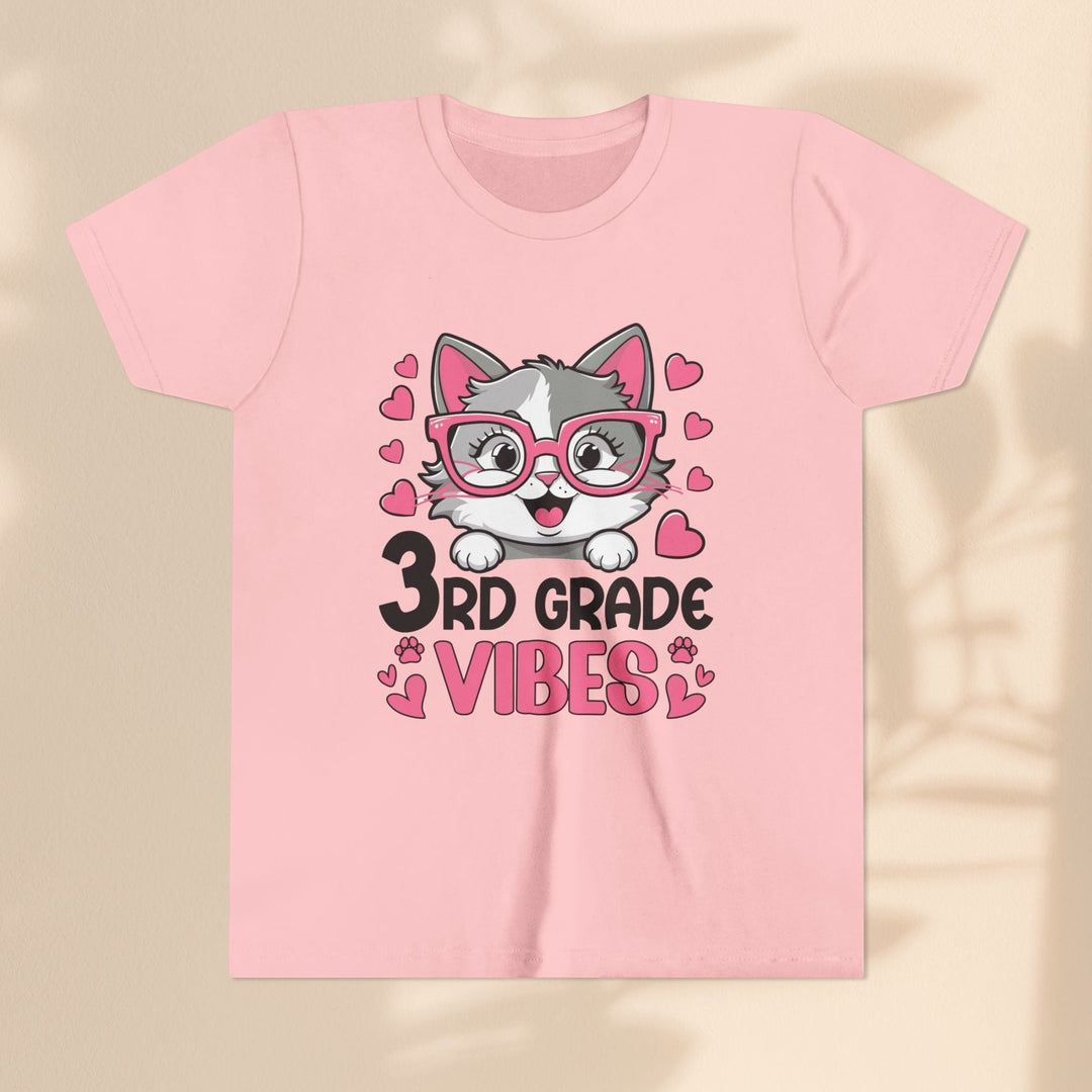 Sea Dragon Dreams pink youth t-shirt featuring a cute cat wearing glasses and 3rd Grade Vibes text graphic.