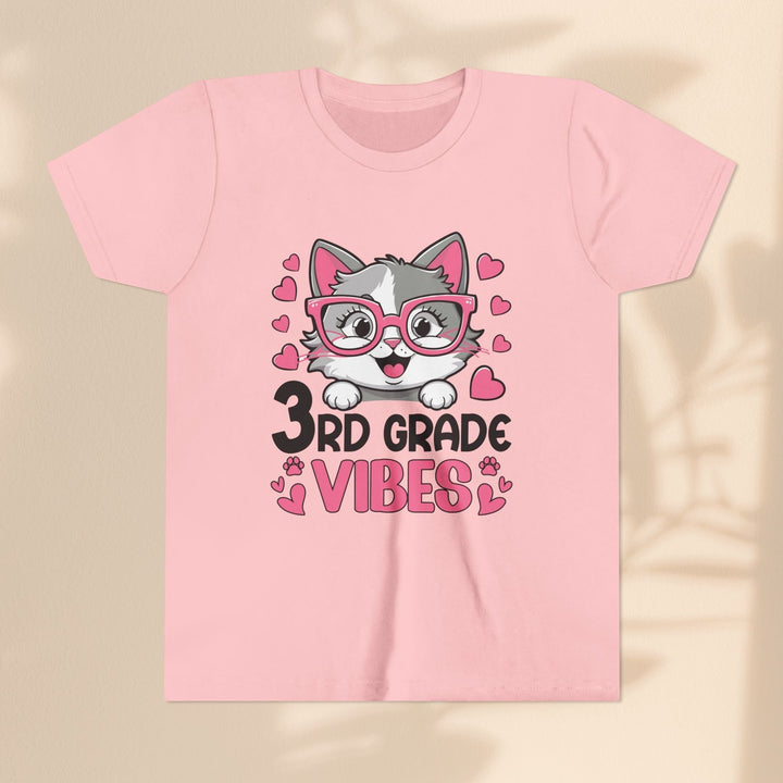 Sea Dragon Dreams pink youth t-shirt featuring a cute cat wearing glasses and 3rd Grade Vibes text graphic.