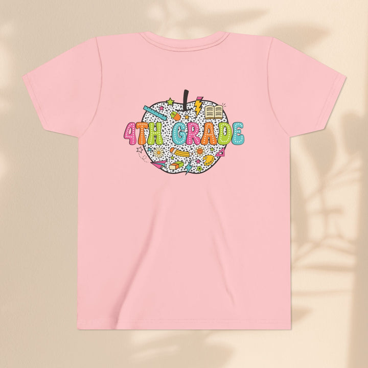 Sea Dragon Dreams light pink youth t-shirt with a 4th Grade apple graphic featuring school supplies and patterns.