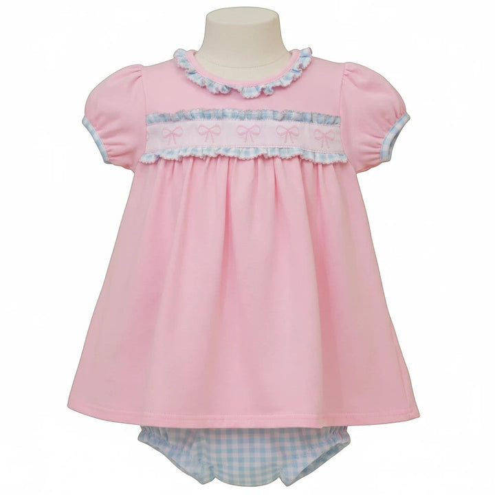 Sea Dragon Dreams pink baby dress with puff sleeves, ruffle trim, and bow-detail chest, paired with gingham bloomers.