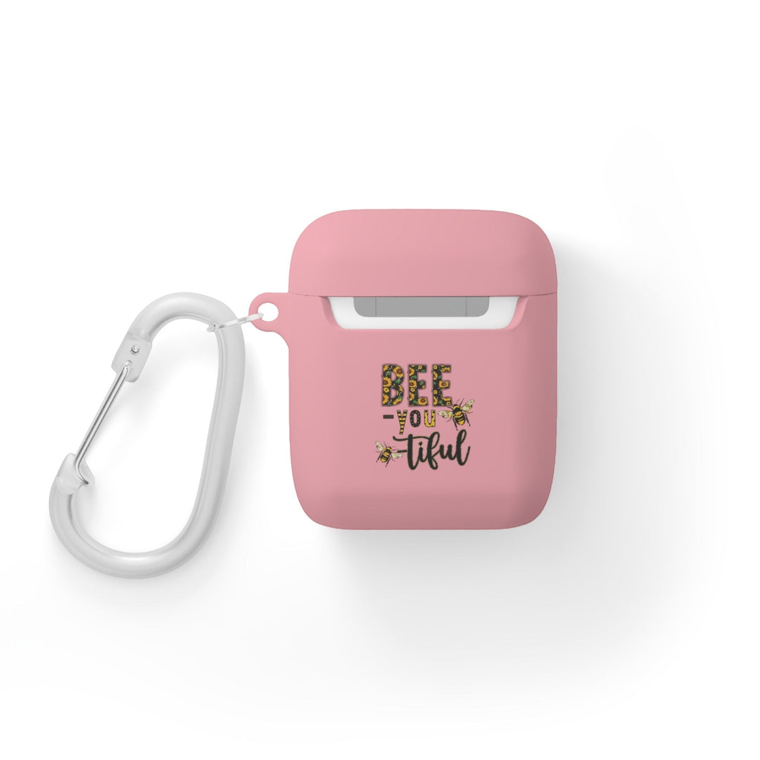 Sea Dragon Dreams pink protective AirPods case with Bee-You-Tiful floral bee design and white metal carabiner clip.