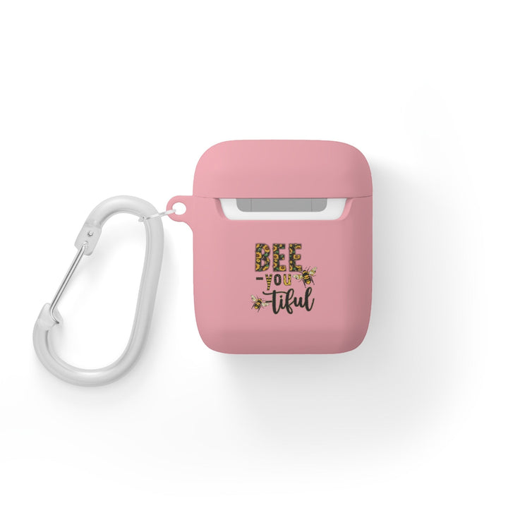 Sea Dragon Dreams pink protective AirPods case with Bee-You-Tiful floral bee design and white metal carabiner clip.