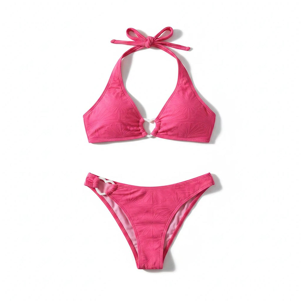 Sea Dragon Dreams hot pink two-piece bikini set with textured fabric, halter neck, and heart-shaped ring accents.