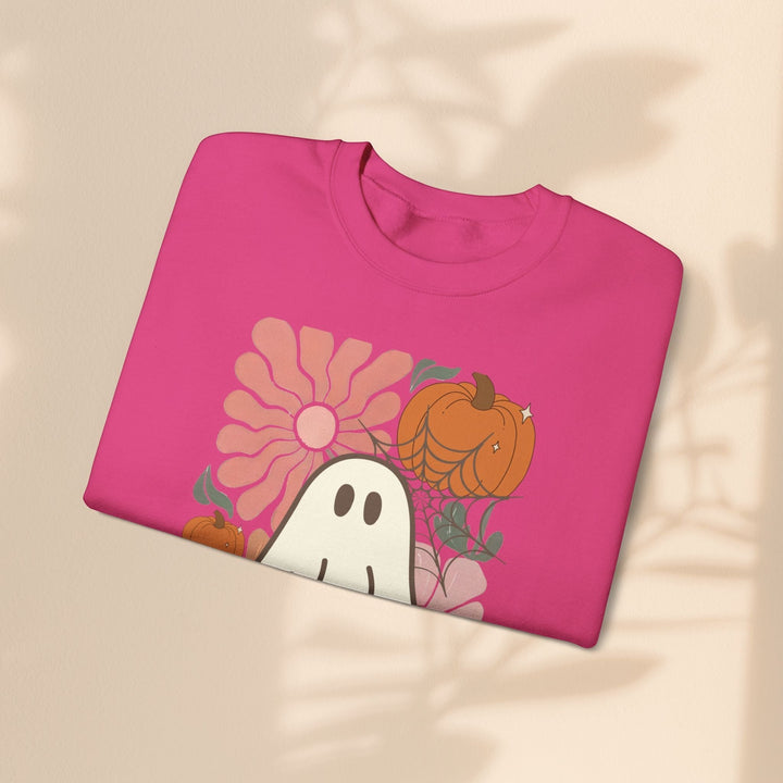 Sea Dragon Dreams pink crewneck sweatshirt featuring a cute ghost, pumpkin, and flower graphic for Halloween.