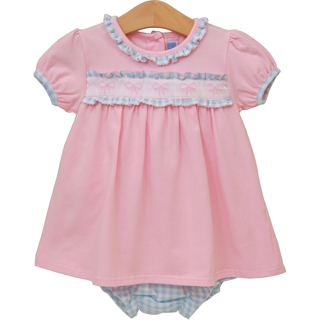 Sea Dragon Dreams pink baby dress with puff sleeves, ruffle trim, and bow-detail chest band with matching diaper cover.
