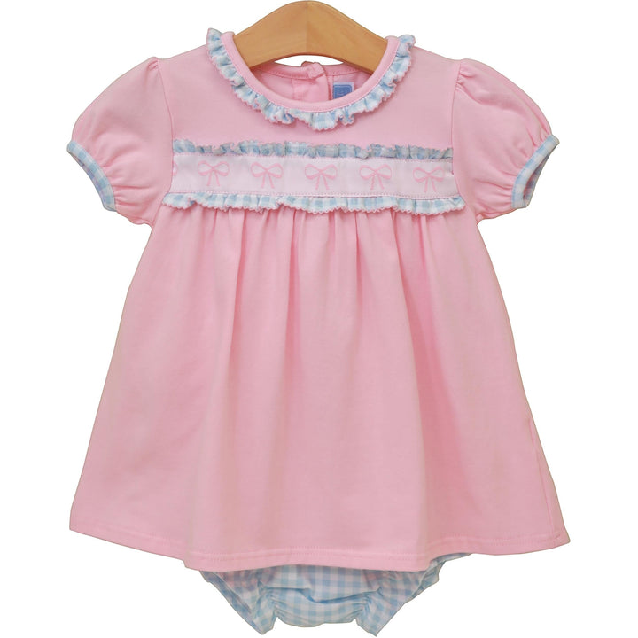 Sea Dragon Dreams pink baby dress with puff sleeves, ruffle trim, and bow-detail chest band with matching diaper cover.