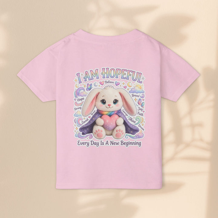 Sea Dragon Dreams toddler t-shirt in light pink cotton featuring a cute bunny graphic with I Am Hopeful text.
