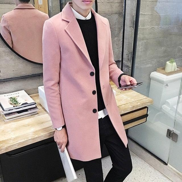 Sea Dragon Dreams men's light pink cotton trench coat with a turn-down collar and black buttons in a modern setting.