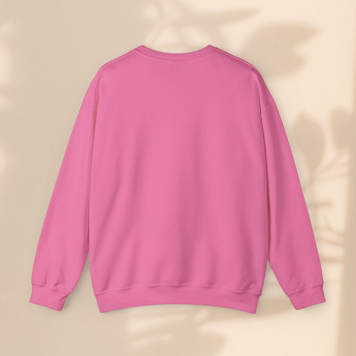 Sea Dragon Dreams unisex pink heavy blend crewneck sweatshirt, back view, showing durable ribbed cuffs and hem.