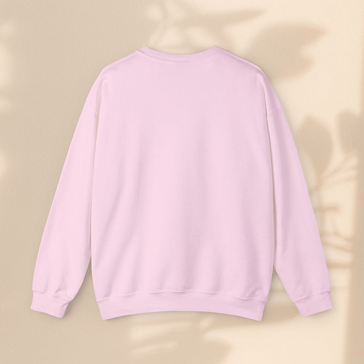 Sea Dragon Dreams light pink unisex crewneck sweatshirt with a classic fit and ribbed cuffs on a neutral background.