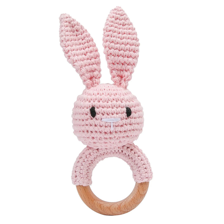 Sea Dragon Dreams pink crochet bunny baby rattle with a wooden teether ring for sensory play and teething