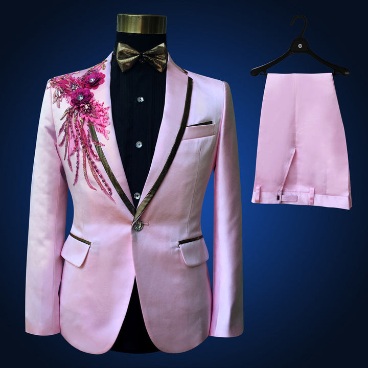 Sea Dragon Dreams pink slim-fit tuxedo suit with floral embroidery, black lapels, vest, bowtie, and matching trousers.