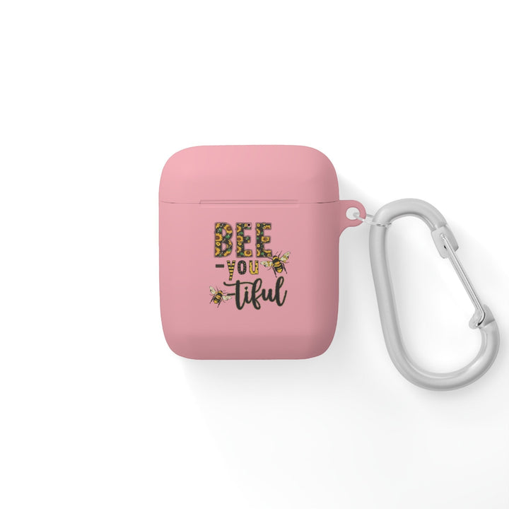 Sea Dragon Dreams pink AirPods case with Bee-You-Tiful floral bee design and a silver metal carabiner clip.