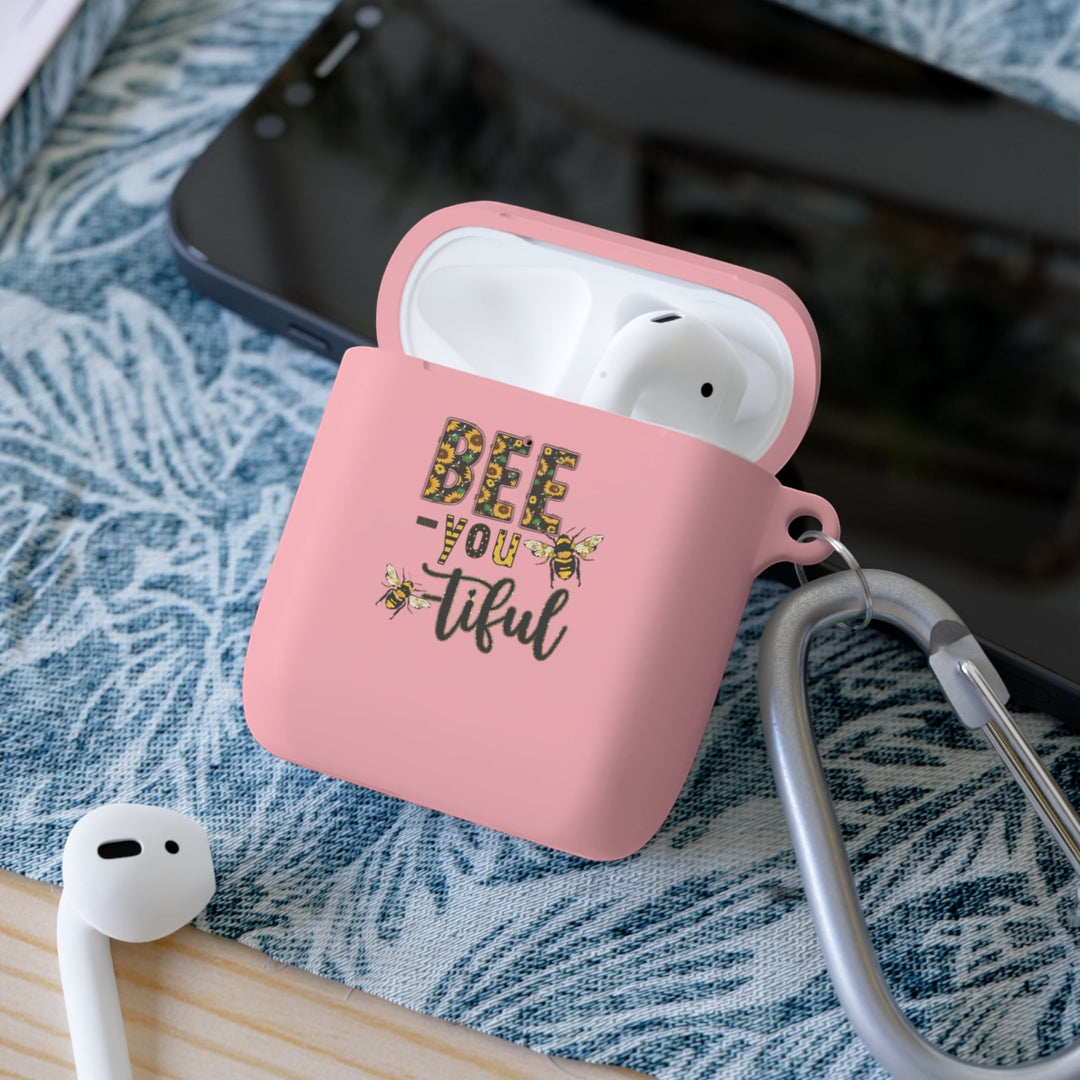 Sea Dragon Dreams pink TPU AirPods case with Bee-You-Tiful floral bee design and a metal carabiner clip.