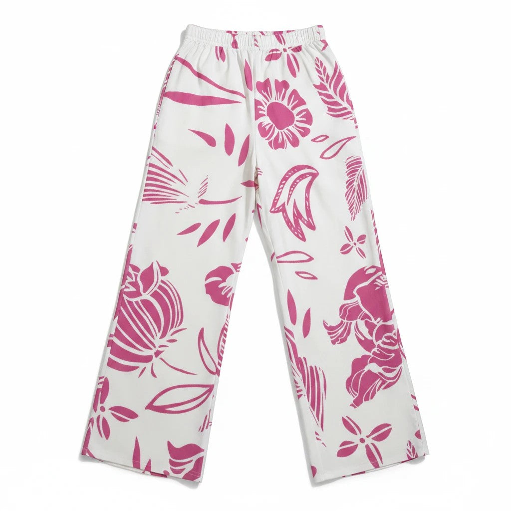 Sea Dragon Dreams wide-leg pants in white with a vibrant pink floral print, featuring a relaxed fit and side pockets.