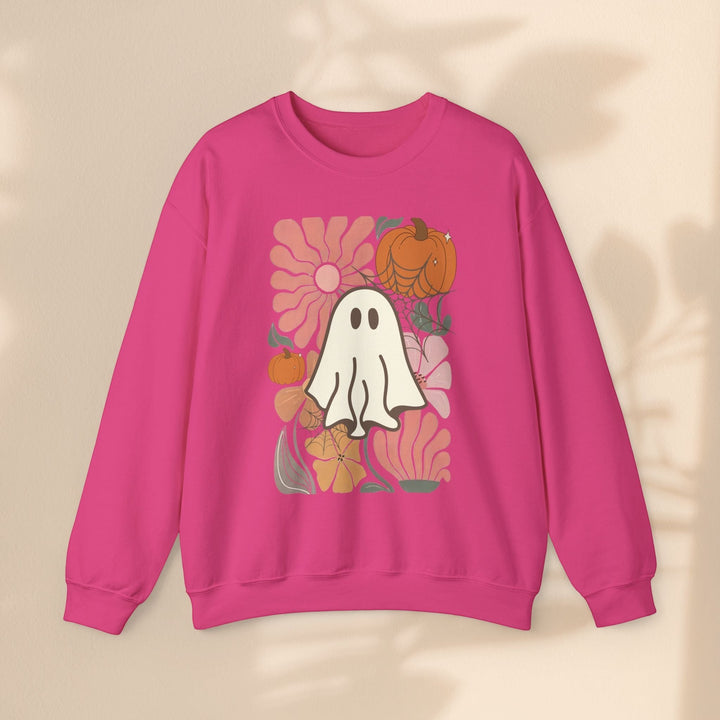 Sea Dragon Dreams pink crewneck sweatshirt featuring a retro ghost, pumpkin, and floral graphic print.