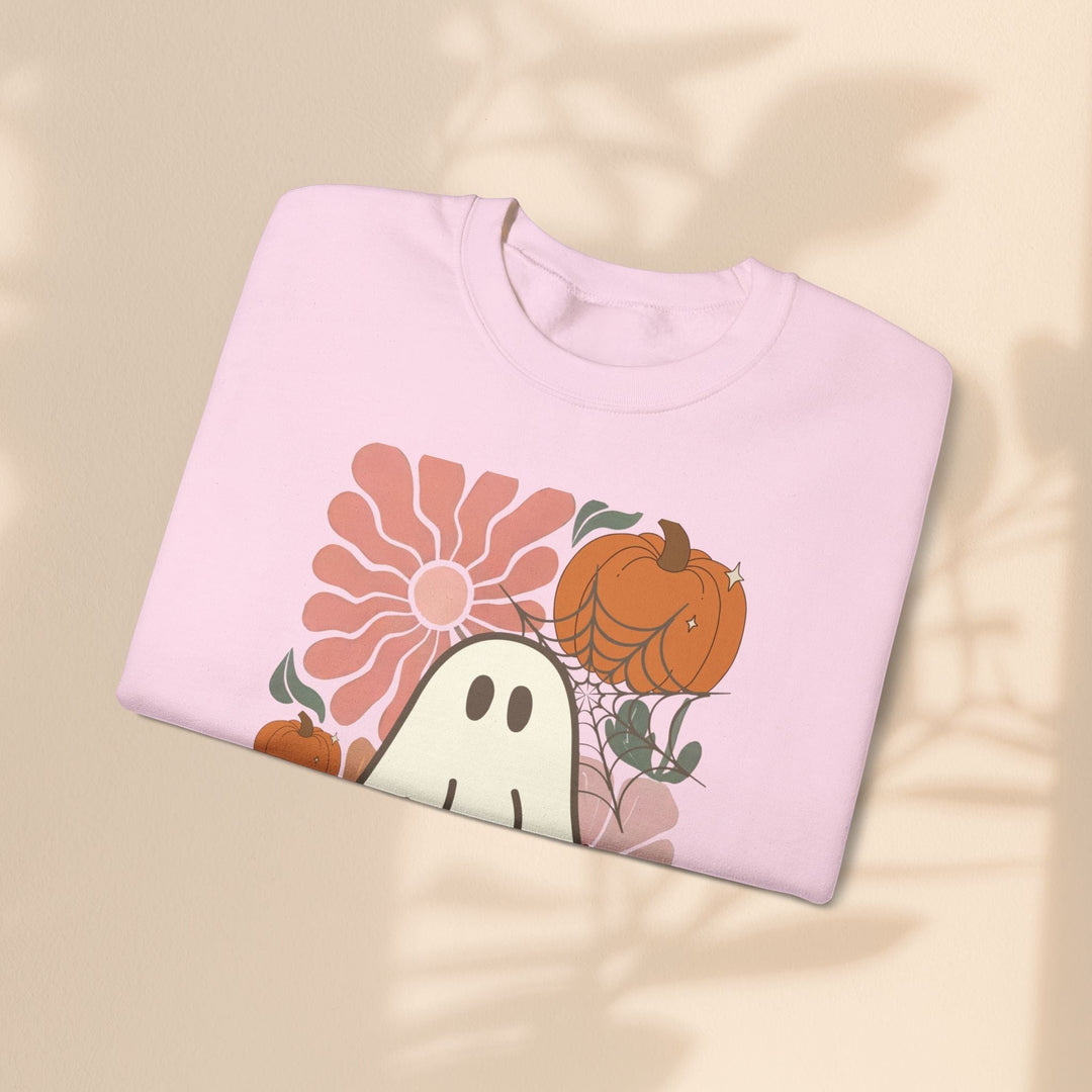 Sea Dragon Dreams light pink crewneck sweatshirt featuring a retro ghost, pumpkin, and flower graphic print.
