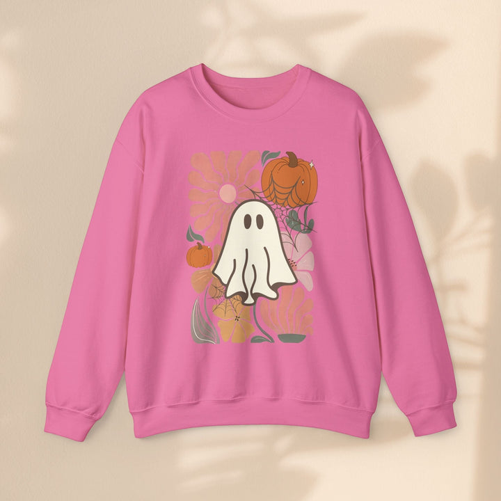 Sea Dragon Dreams pink crewneck sweatshirt featuring a retro ghost and pumpkin graphic print.