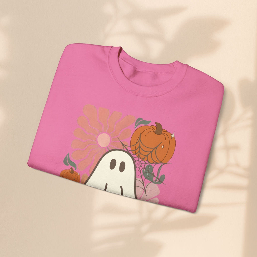 Sea Dragon Dreams pink crewneck sweatshirt featuring a cute ghost, pumpkin, and floral Halloween graphic print.