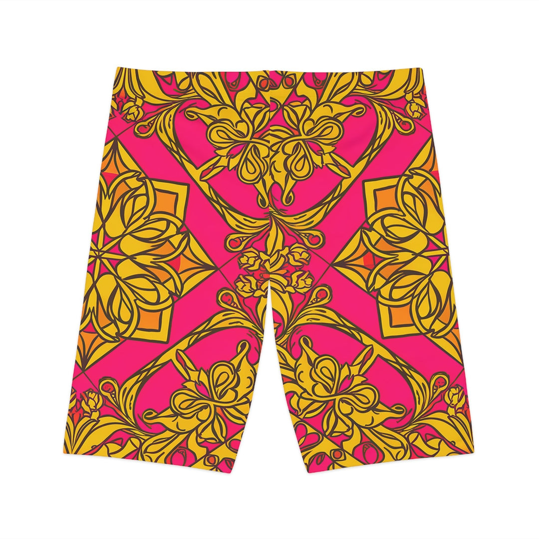 Sea Dragon Dreams women's bike shorts featuring a vibrant pink and gold symmetrical floral pattern in polyester blend