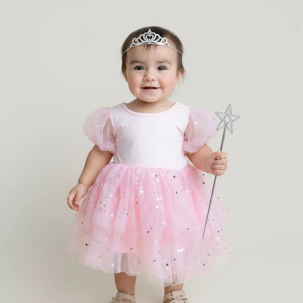 Sea Dragon Dreams toddler girl wearing a pink Good Witch costume with puff sleeves, tulle skirt, and star accents.