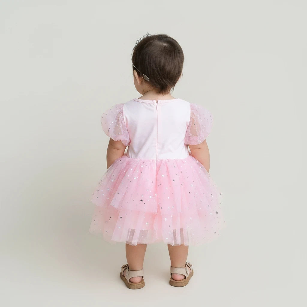 Sea Dragon Dreams girls' pink Good Witch costume dress with puff sleeves and a star-patterned layered tulle skirt