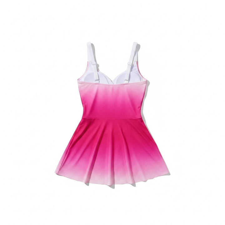 Sea Dragon Dreams pink gradient one-piece swim dress with a flattering skirted silhouette and white adjustable straps.