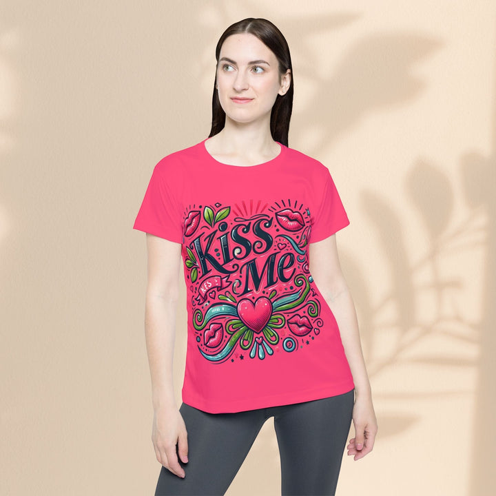 Sea Dragon Dreams women's pink sports jersey featuring a playful Kiss Me graphic with hearts and lips design.