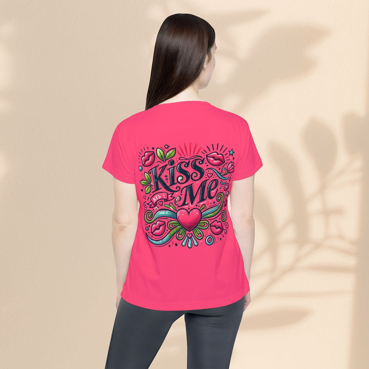 Sea Dragon Dreams women's pink sports jersey with Kiss Me graphic print on the back, worn by a woman from behind.