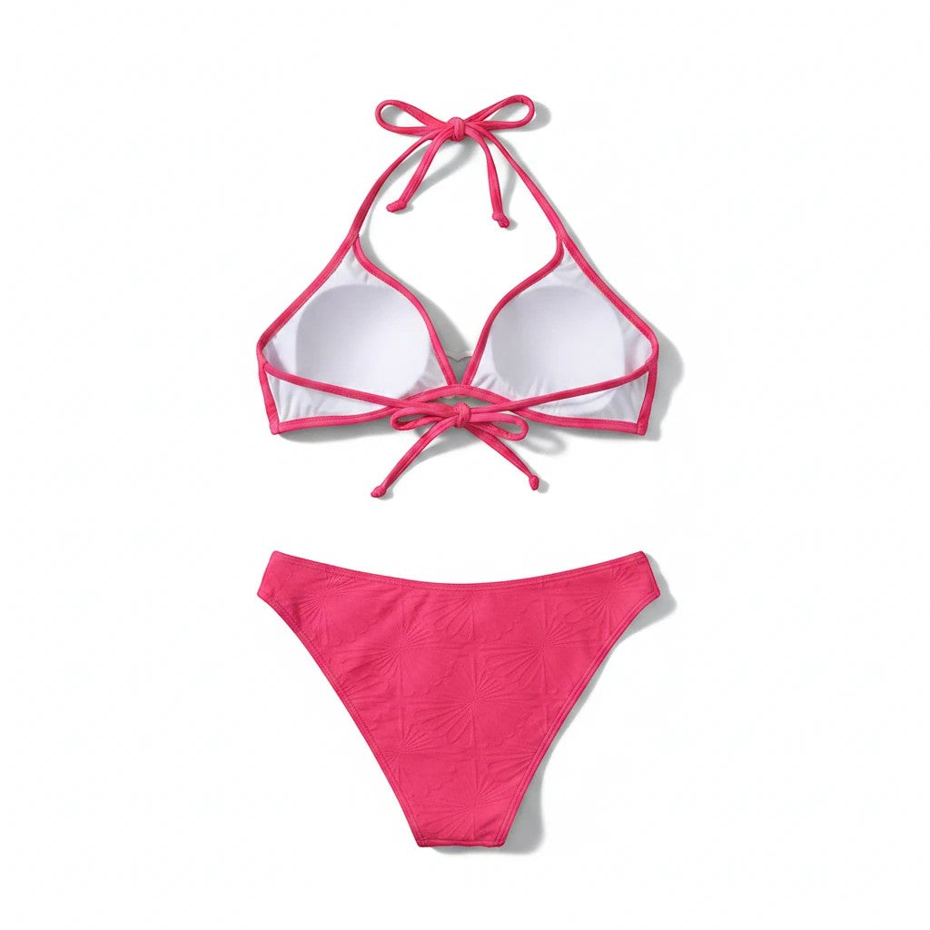 Sea Dragon Dreams pink lace-up bikini set with textured fabric and adjustable straps on a white background