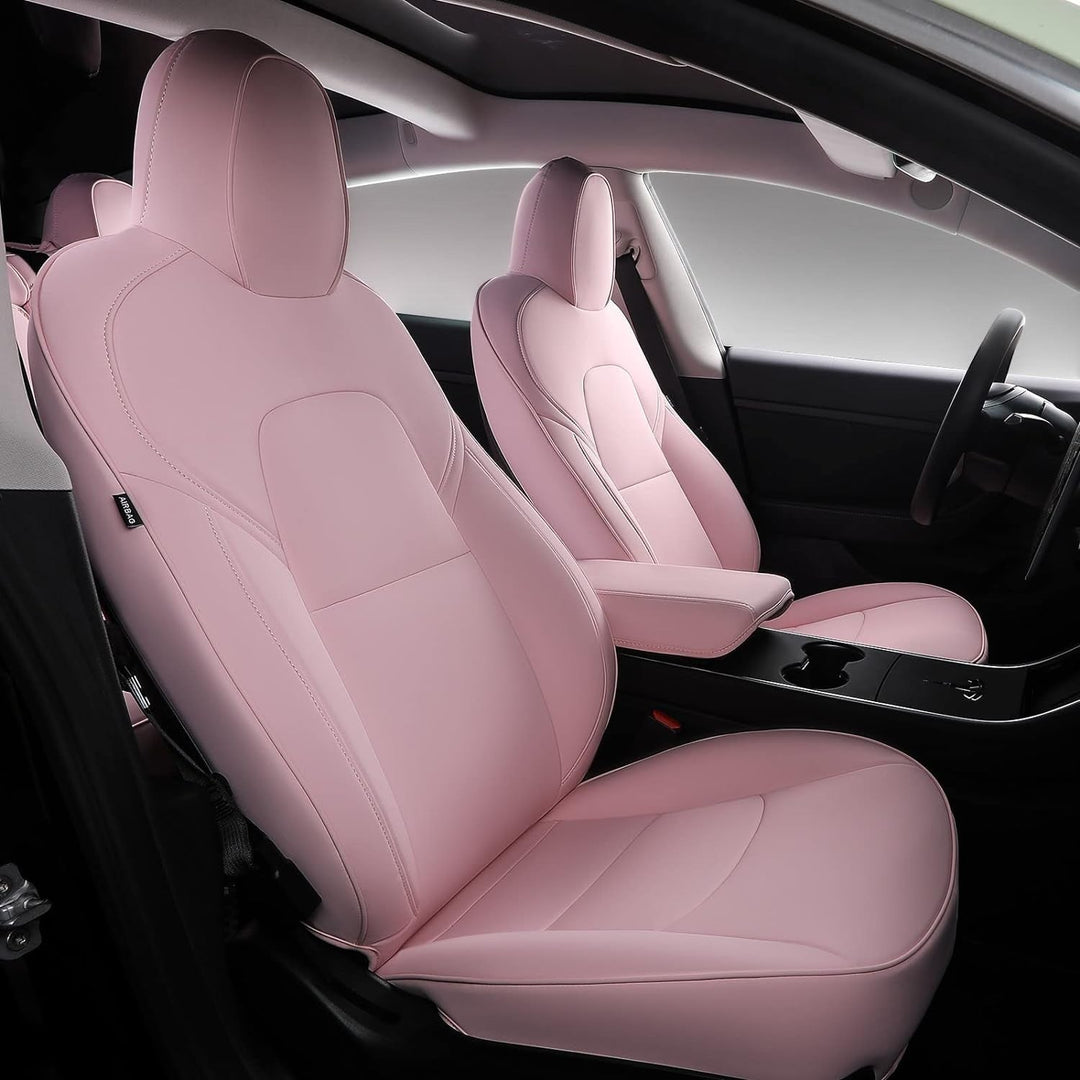 Sea Dragon Dreams pink leather seat covers installed in a Tesla Model 3 or Model Y interior for a custom look.