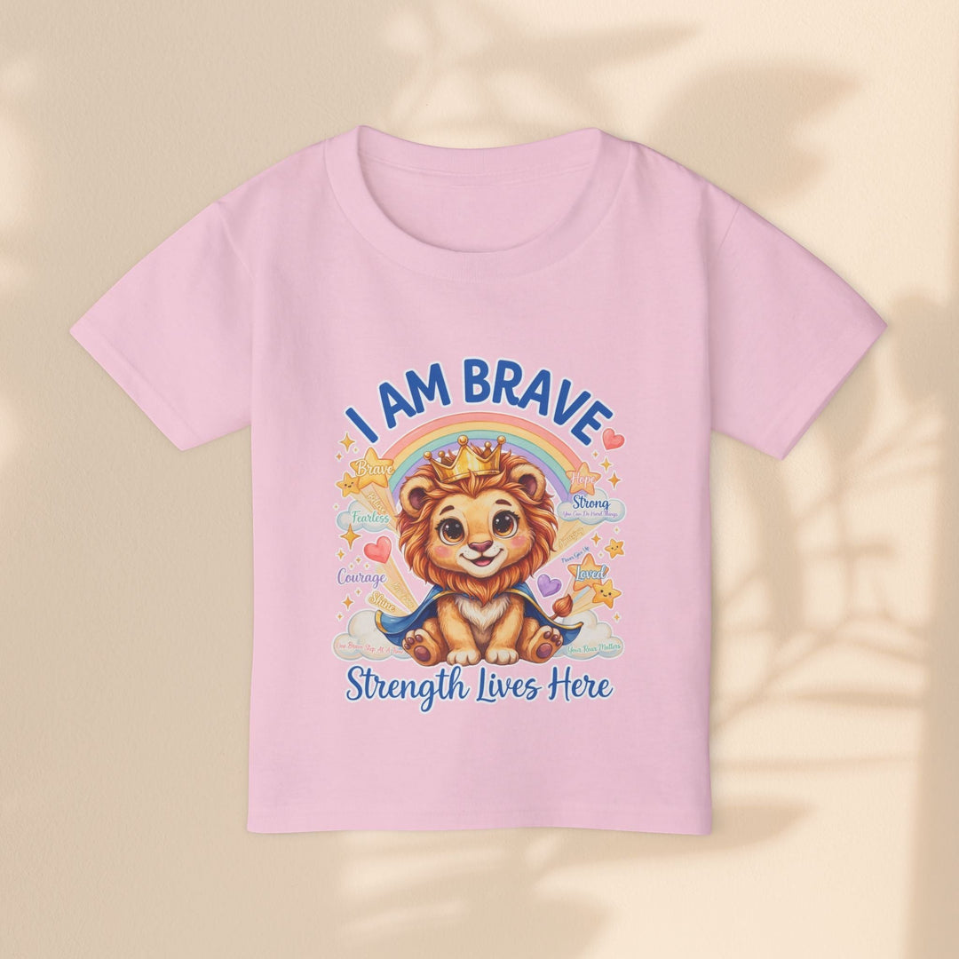 Sea Dragon Dreams toddler t-shirt in light pink cotton featuring a cute lion wearing a crown and the text I Am Brave
