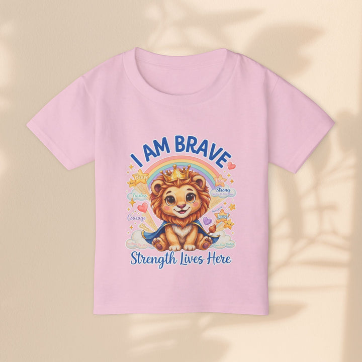 Sea Dragon Dreams toddler t-shirt in light pink cotton featuring a cute lion wearing a crown and the text I Am Brave